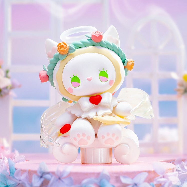 The Lucky Emma Secret Forest Wedding - Blind Box by Lucky Emma features a charming cat angel figurine with green eyes, a flower crown, heart accents, and translucent wings on a pastel base—perfect for Secret Figures collectors.