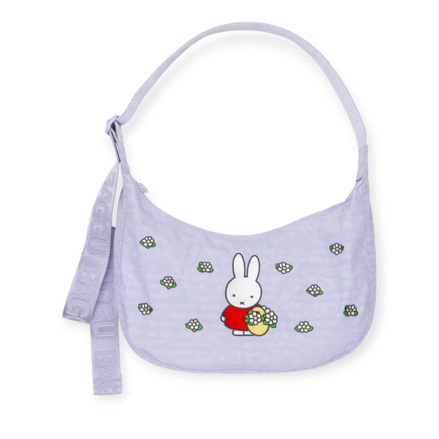 The Miffy x Baggu Medium Nylon Crescent is a lavender crossbody bag with a cartoon bunny and floral details, an adjustable "BAGGU" strap, and recycled nylon—making this playful Baggu accessory perfect for everyday use.