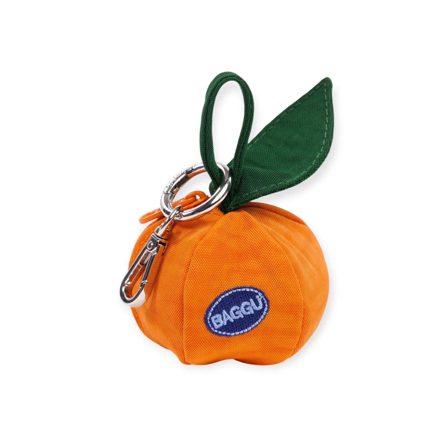 Orange Baggu bag charm with green leaf tab, metal clip, and small logo patch