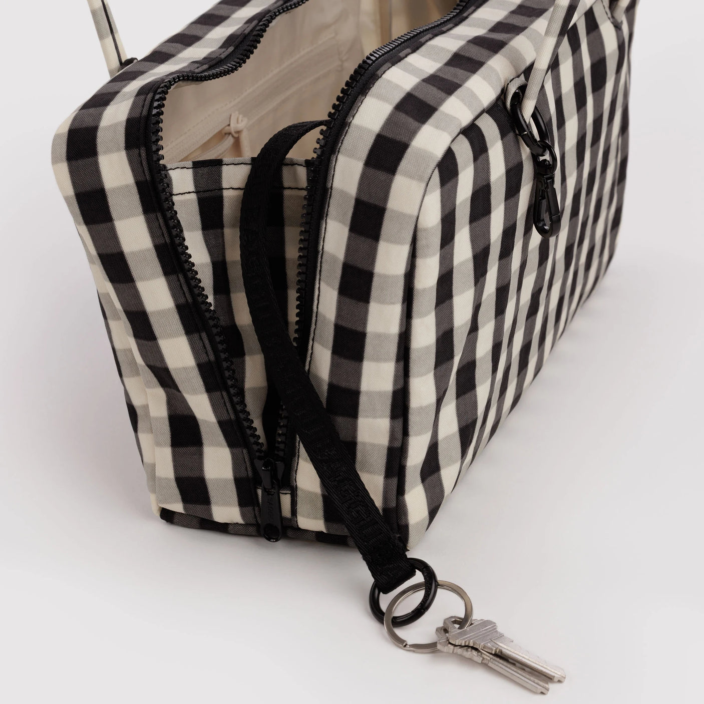 Gingham nylon bowler bag with zipper opening, black trim, keyring clip