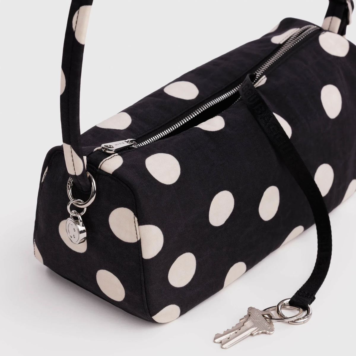 Baggu black nylon polka dot loaf bag with front zipper and key fob