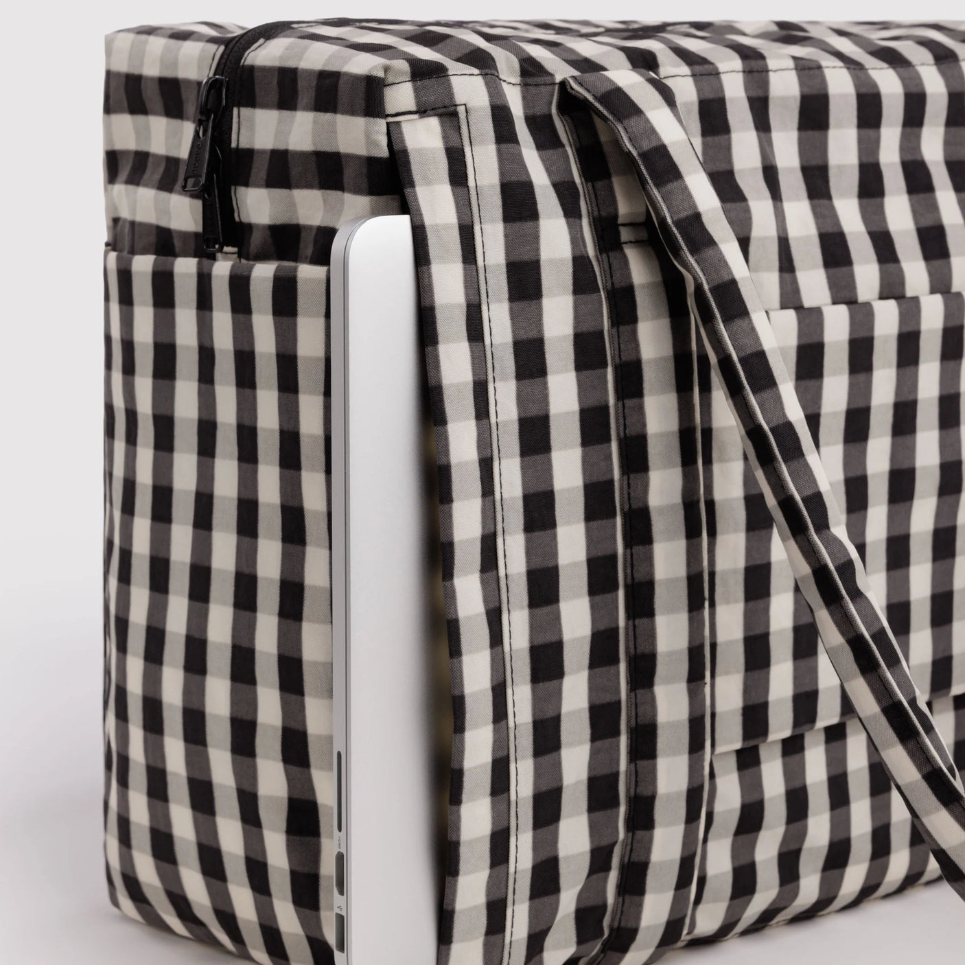 Baggu small carry-on bag in black-and-cream gingham, side panel and fastening strap