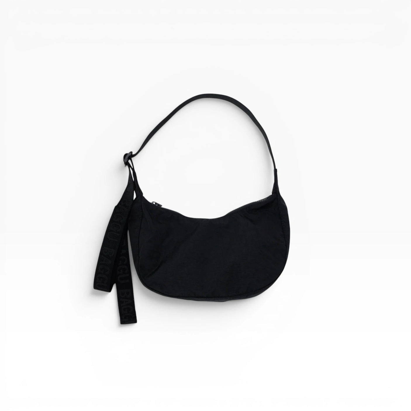 Black Baggu small nylon crescent bag with drawstring strap and dangling key tag