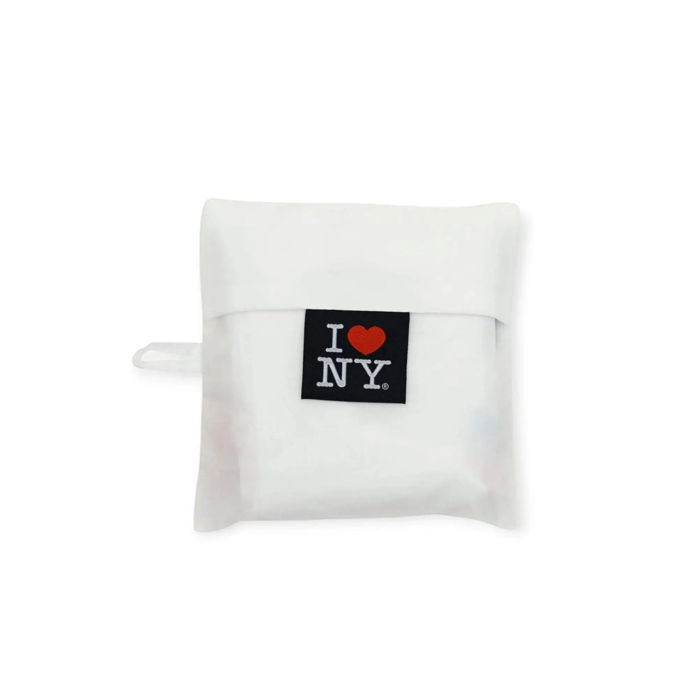 Folded white tote bag with I Love NY logo patch at center