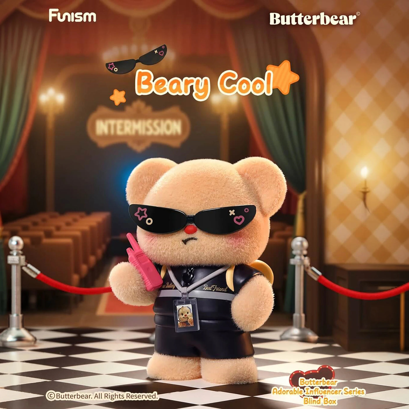 Plush bear in black jacket and sunglasses holding pink phone in theater lobby with "Intermission" sign in background
