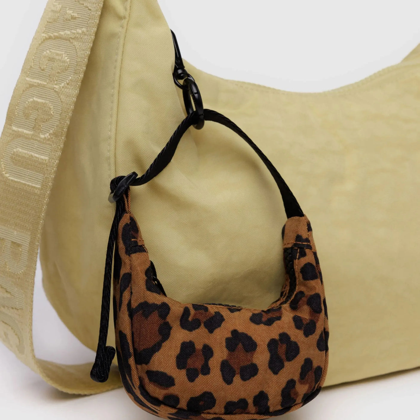 Leopard print crescent bag charm with black strap and metal ring
