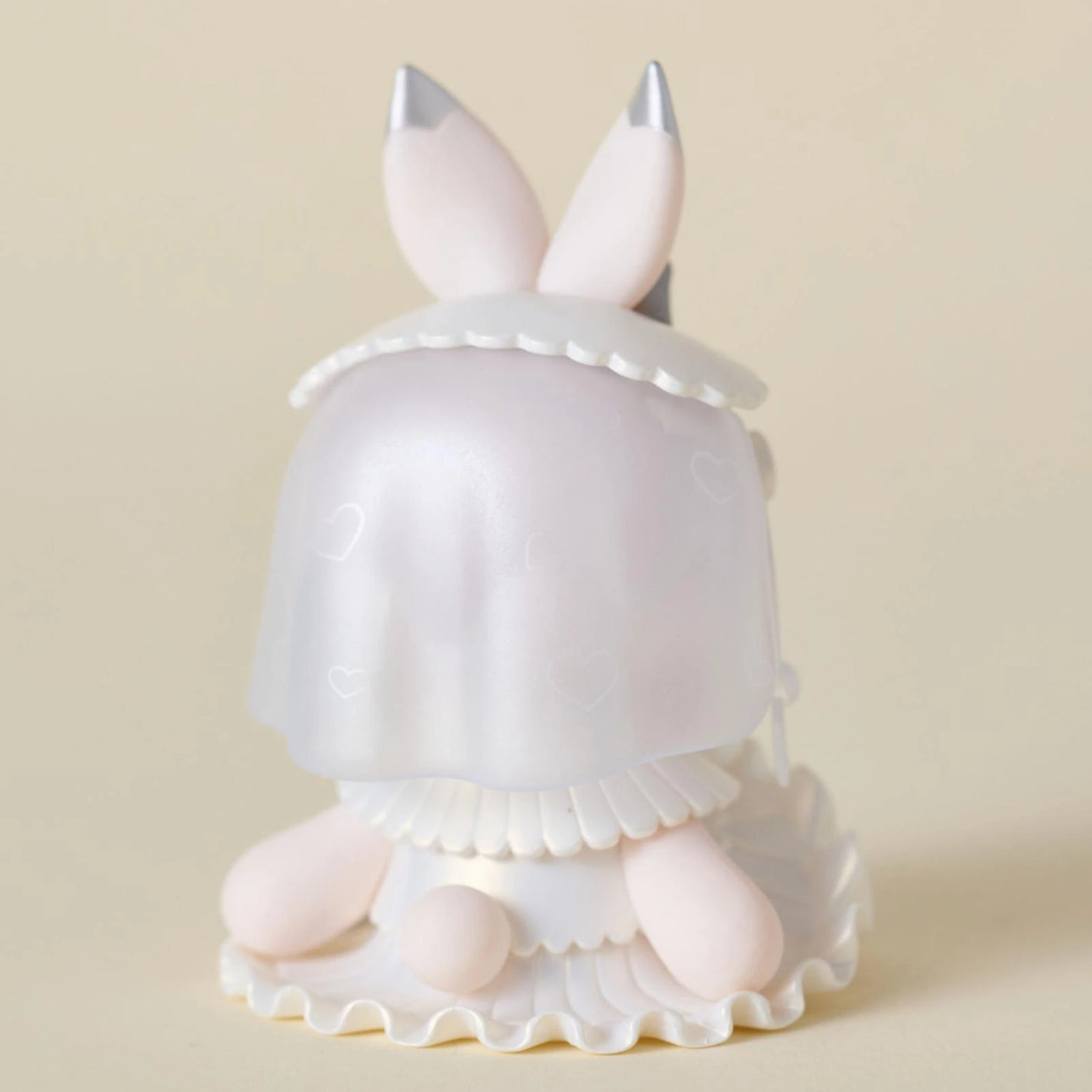 A charming Lucky EMMA Secret Forest Wedding Blind Box figurine by Lucky Emma, featuring bunny ears, a translucent veil, and a ruffled base, is displayed against a plain beige background.