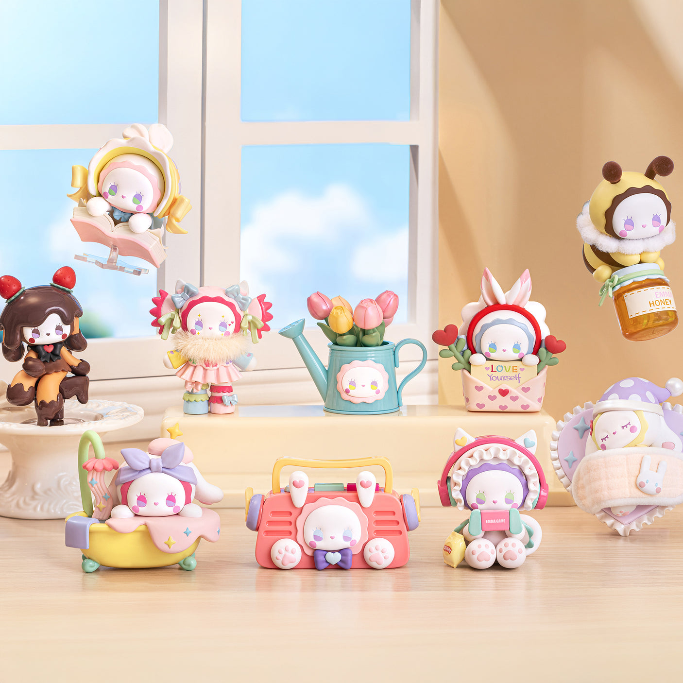 Collection of colorful Emma Secret Forest Love Dopamine Series blind box art toys displayed on wooden surface by window