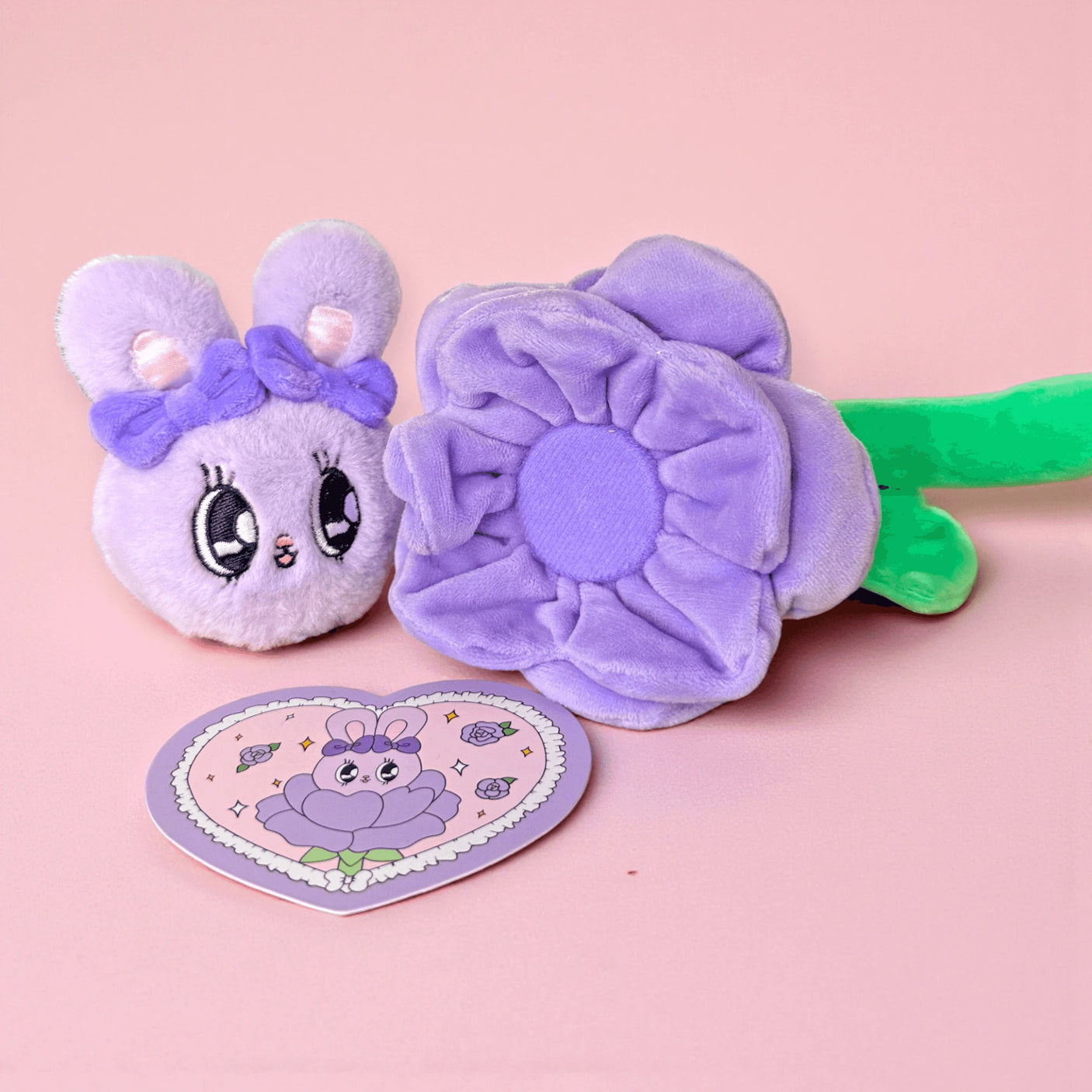 Purple plush bunny flower blind box toy with round character tag and green stem