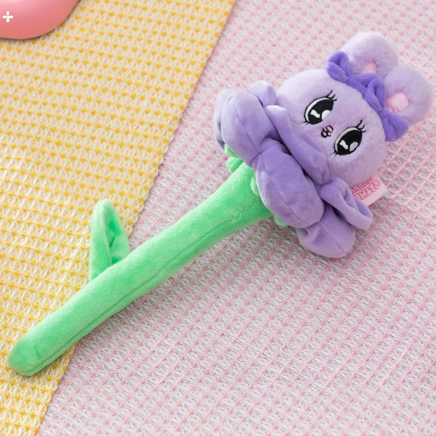 Purple plush bunny flower blind box toy with ruffled petals and green stem