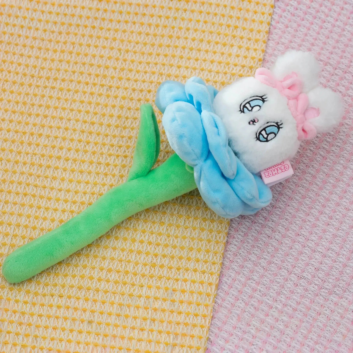 Blue plush bunny flower blind box toy with ruffled petals and green stem
