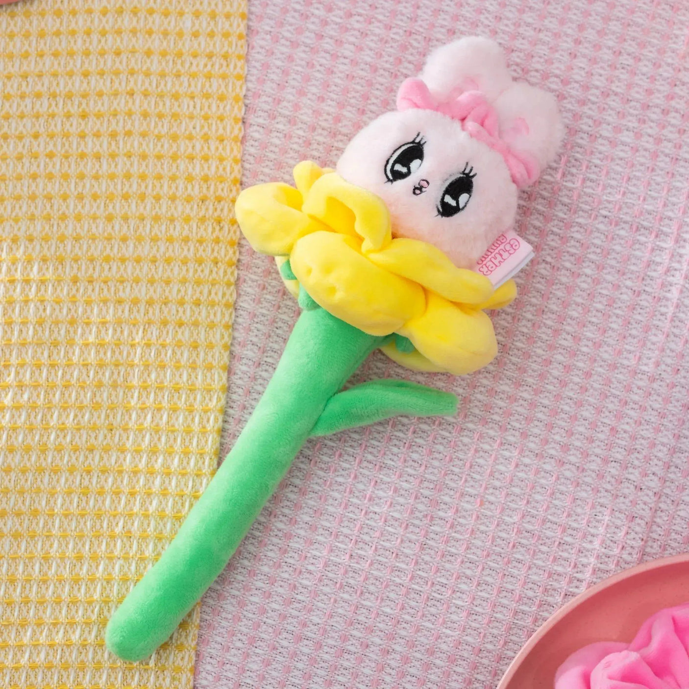 Yellow plush bunny flower blind box toy with ruffled petals and green stem
