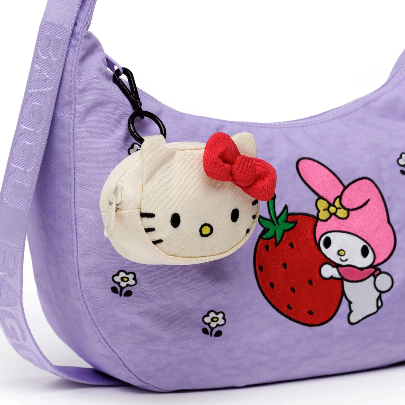 Hello Kitty bag charm with cream face pouch and red bow, keyring clip attached