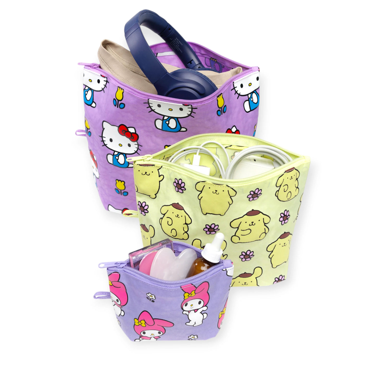 The Baggu Hello Kitty x Baggu Go Pouch Set includes three zippered pouches with Sanrio designs, ideal for organizing headphones, charging cables, small bottles, and more while keeping your essentials stylishly organized.
