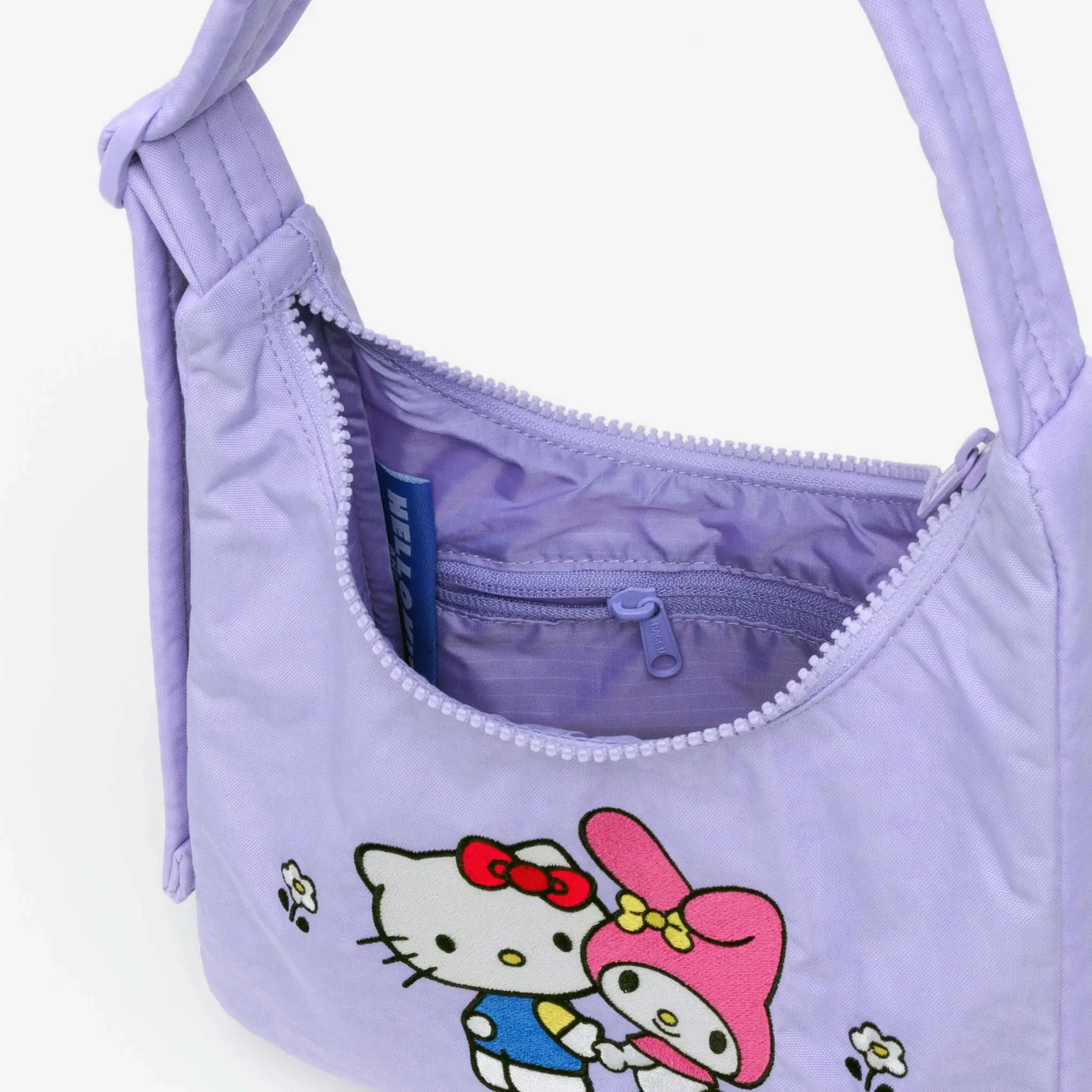 Lavender mini nylon shoulder bag with open zip and inside pocket detail