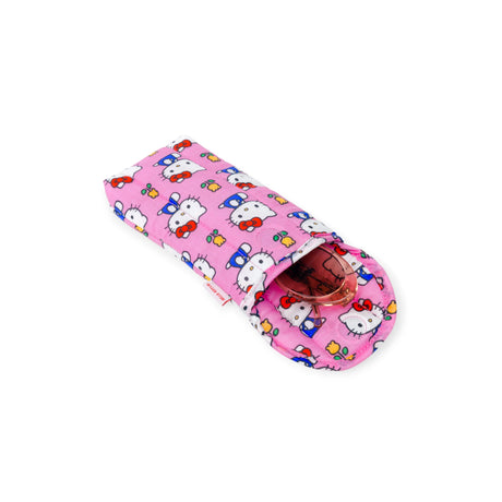 A soft, pink Hello Kitty x Baggu Puffy Glasses Sleeve by Baggu, featuring a Hello Kitty pattern and partially open to reveal red-framed glasses inside.