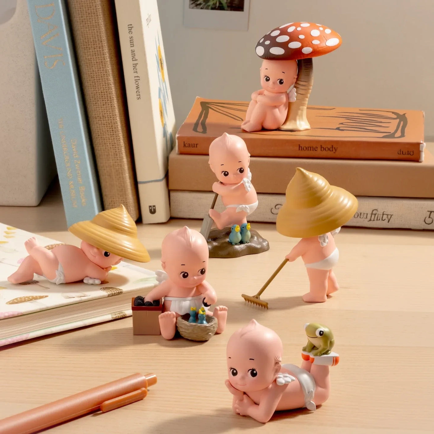 Kewpie In the Garden figurines with mushroom hats, watering can, and garden props
