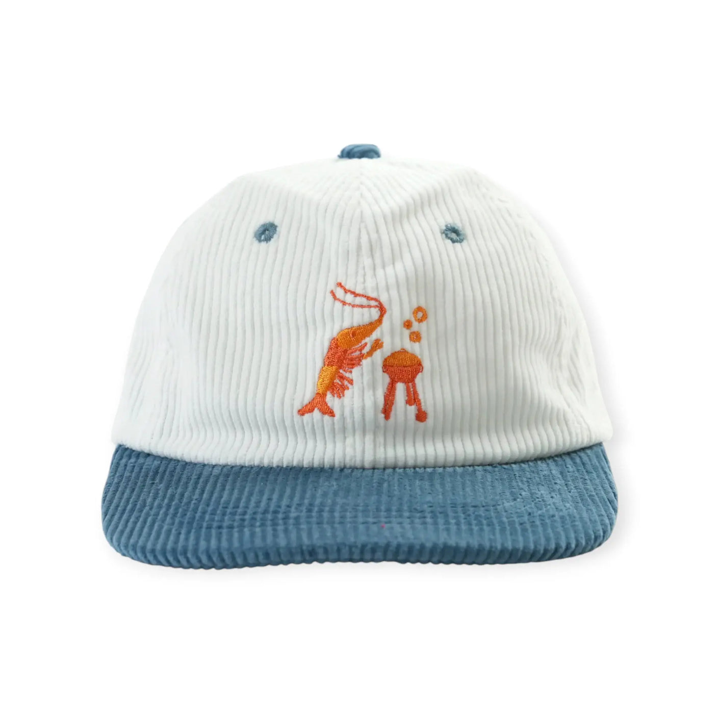 White corduroy baseball cap with blue brim and embroidered shrimp cartoon on front