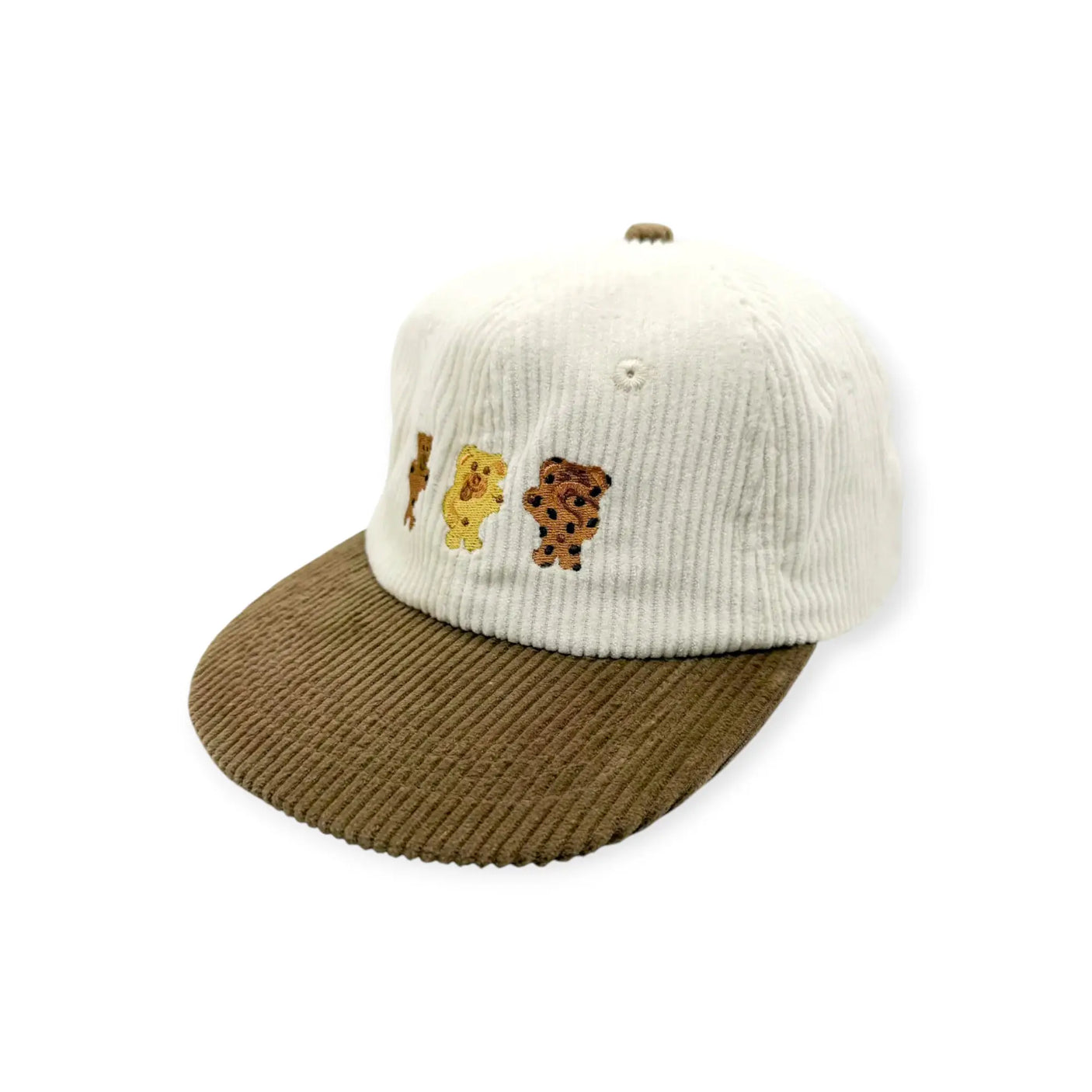 Ribbed cap with tan crown, brown brim, and embroidered bear patch