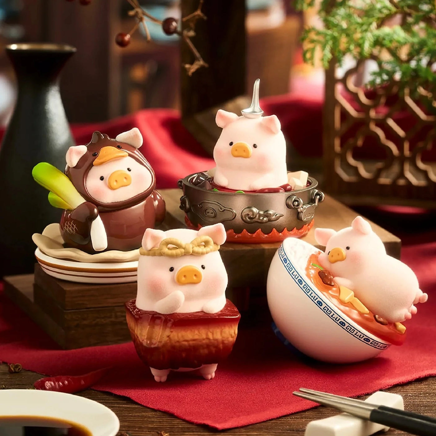 Pig chef toy figurines with mini dishes, soup pot, and utensils on a table