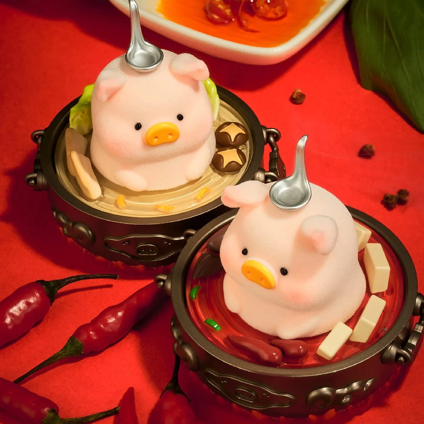 Piggy blind box figures in round pots with ladles, red chili pieces and peppers on tray