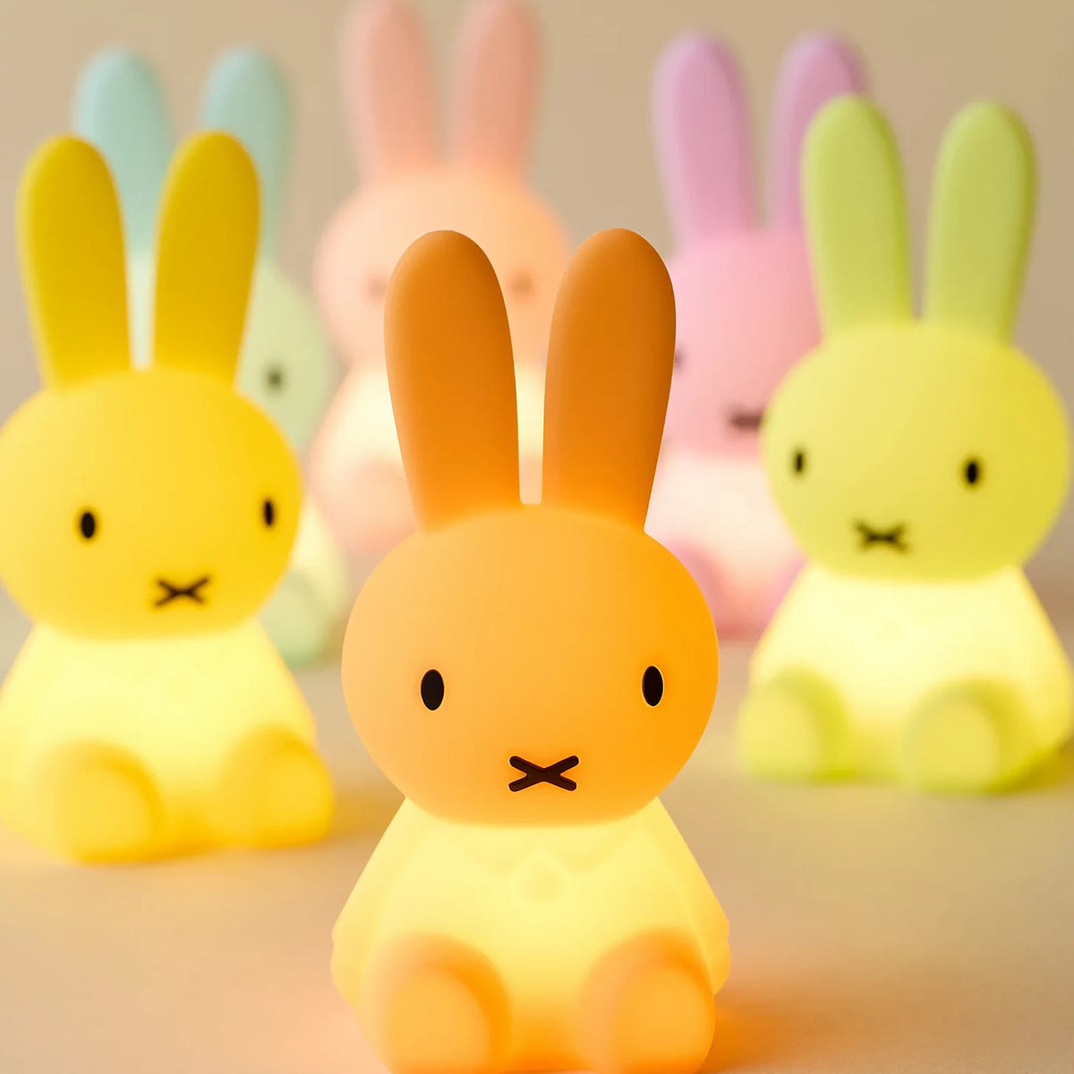 Group of Miffy mini light bunny figurines in yellow, orange, pink, and green