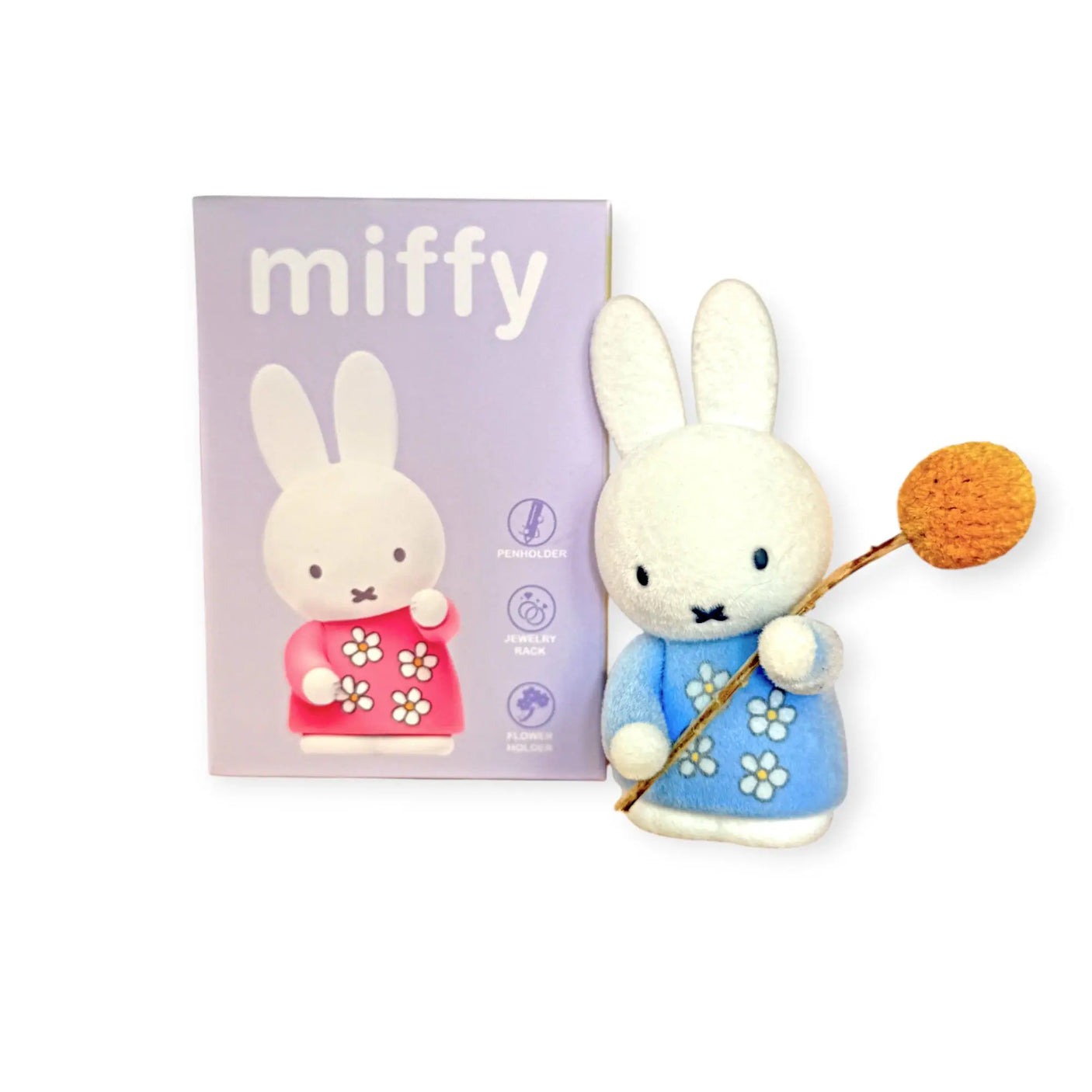 Miffy blind box package with bunny figure holding a blue flower and mallet