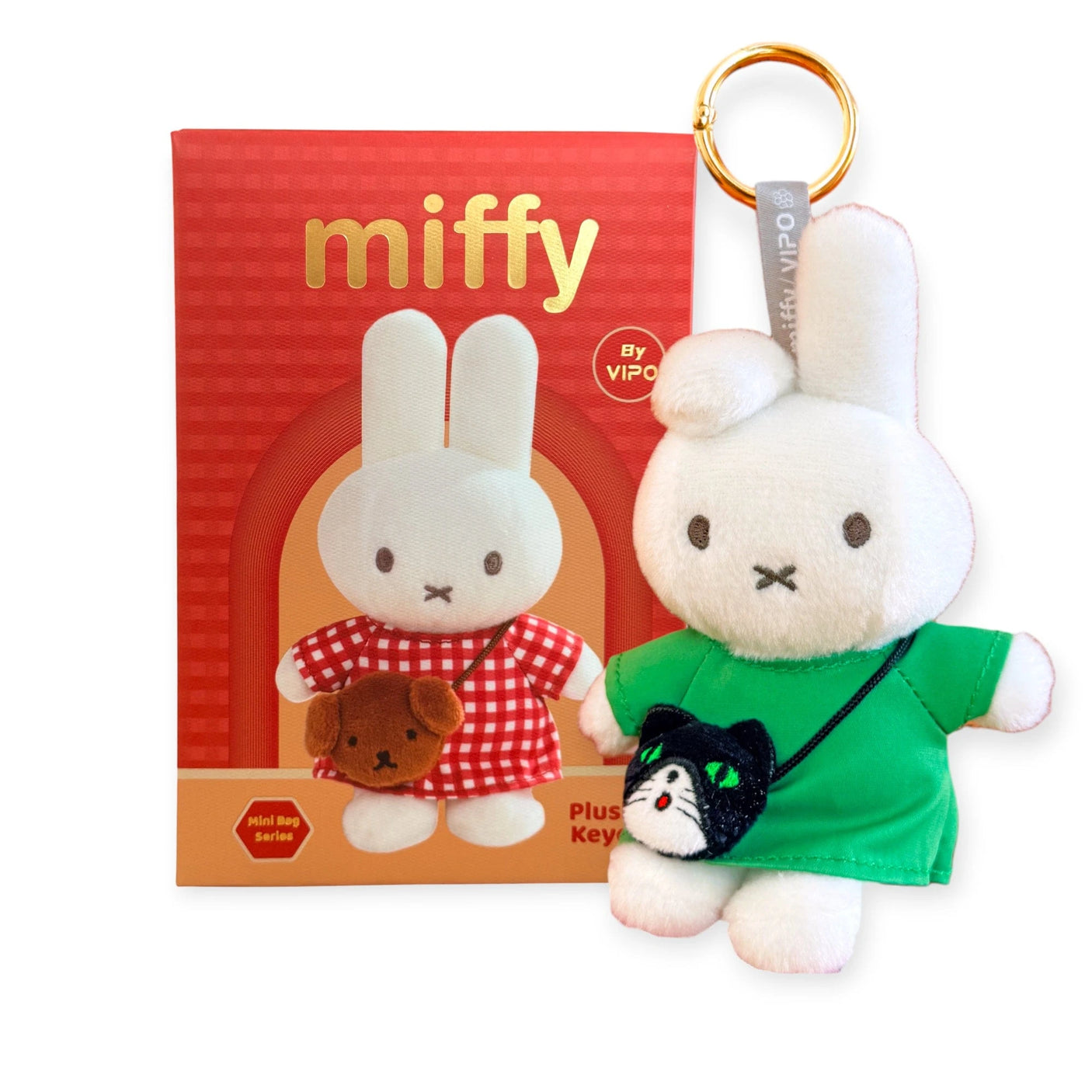Plush bunny keychain in a green outfit with Miffy-themed box packaging