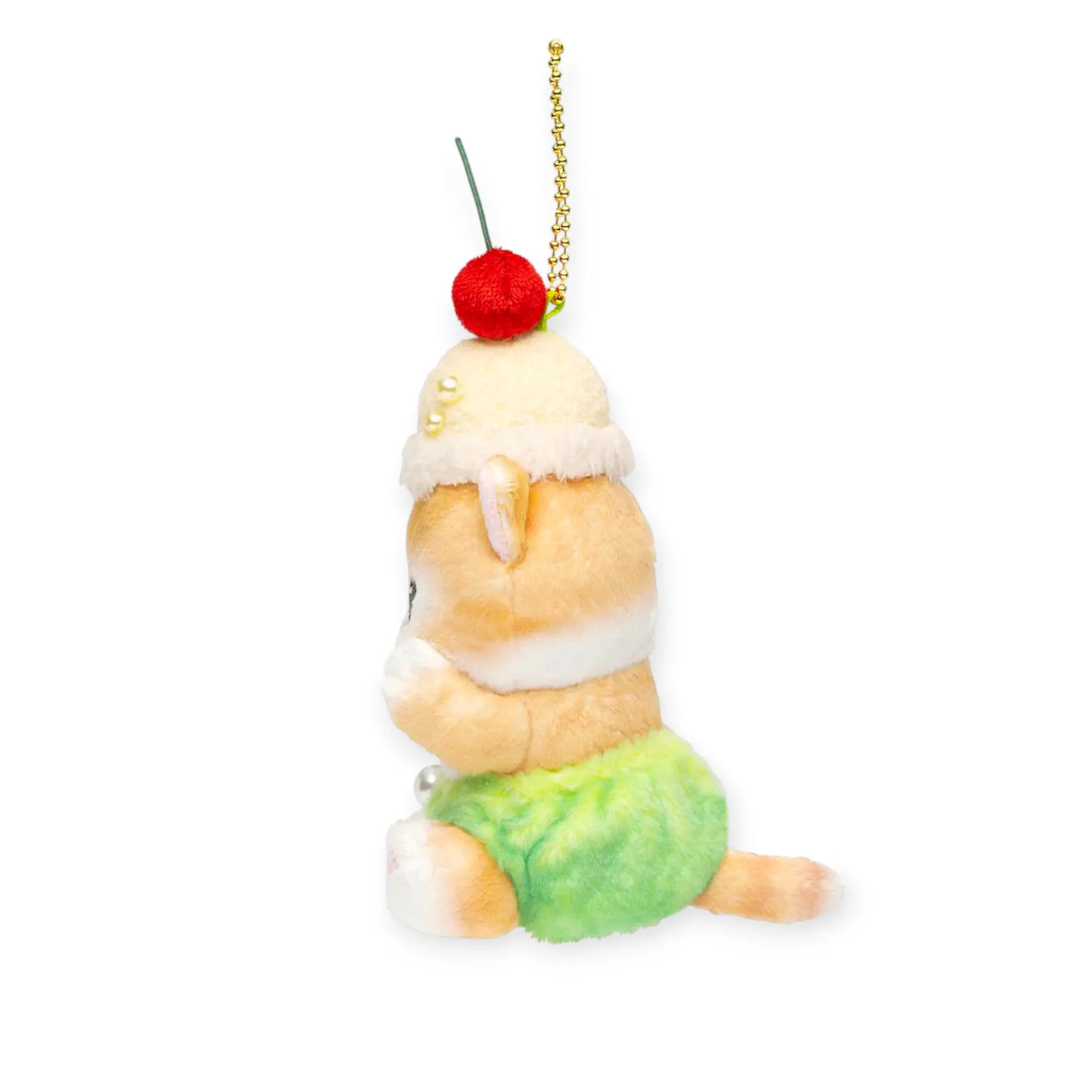 Side view plush keychain with gold chain and red cherry pom, cream cat in green shorts