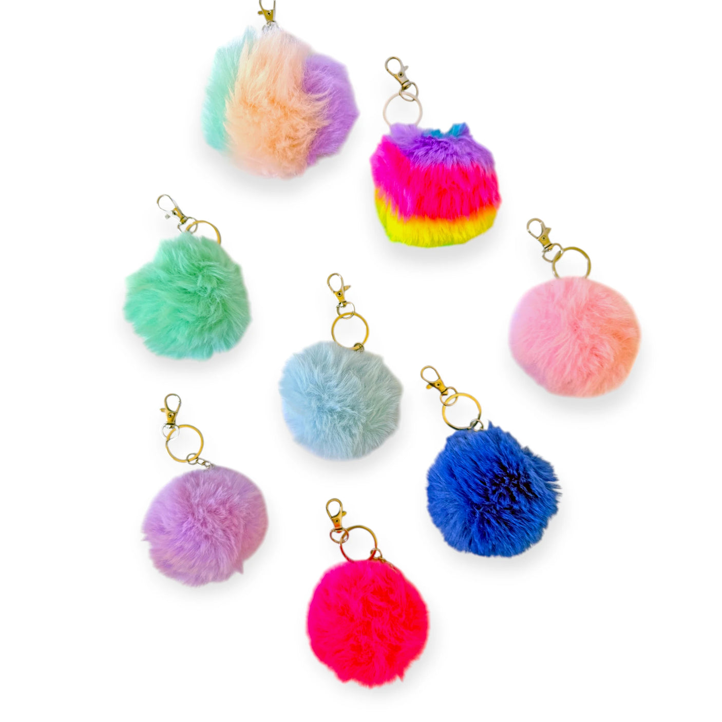 Collection of colorful fluffy pom pom bag charms with lobster claw clips for easy attachment to bags or keys