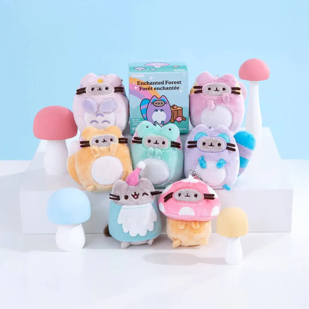 Assorted plush character keychains with blind box packaging, pastel colors