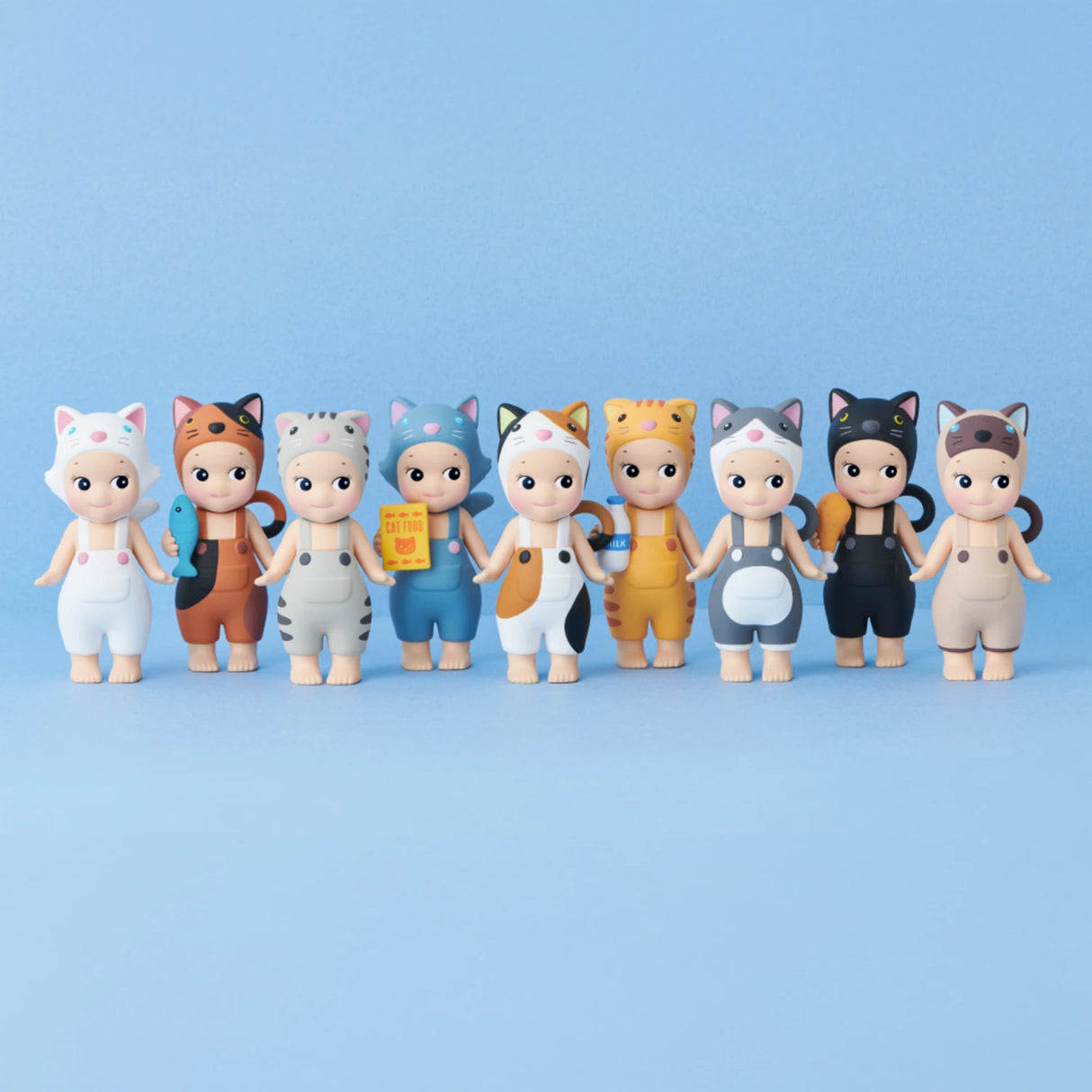 Nine small figurines from the Sonny Angel Cat Life Series - Blind Box, dressed in animal-themed outfits, are lined up against a light blue background.