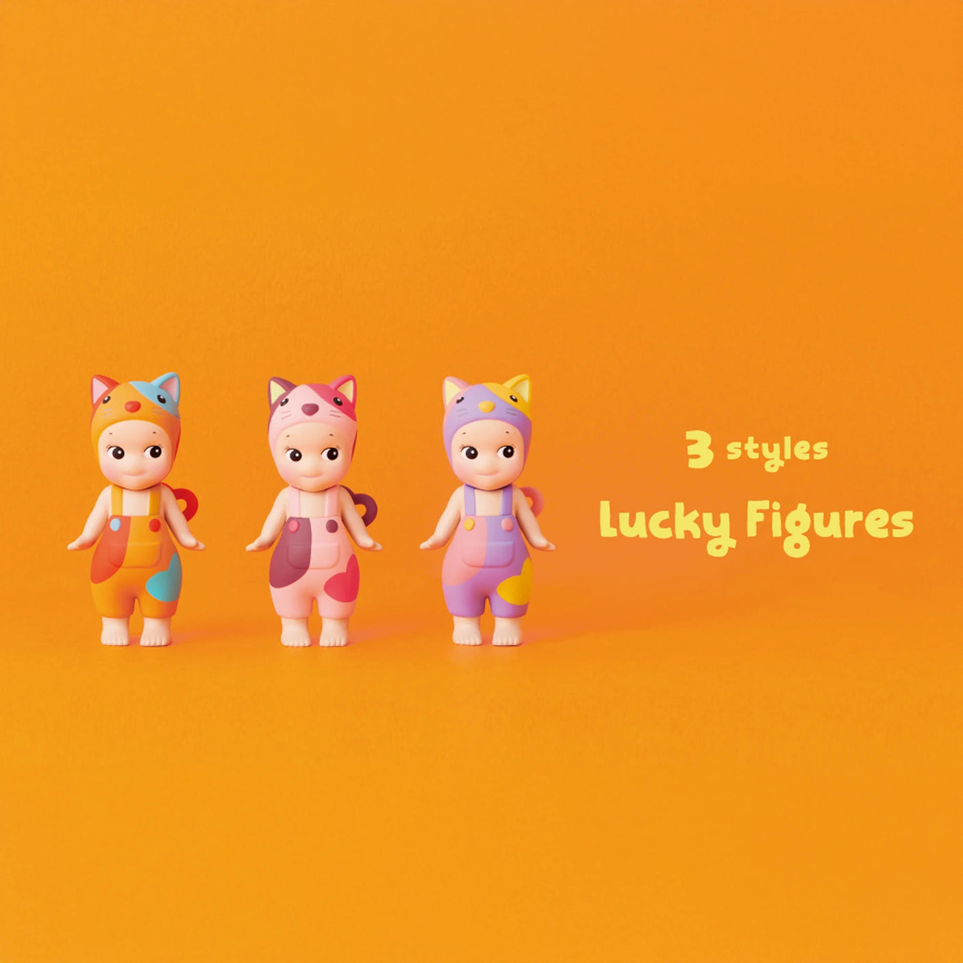 Three vibrant toy figures wearing cat-ear hats are arranged against an orange backdrop. Text reads "3 styles Lucky Figures" from the Sonny Angel Cat Life Series, showcasing limited edition designs.