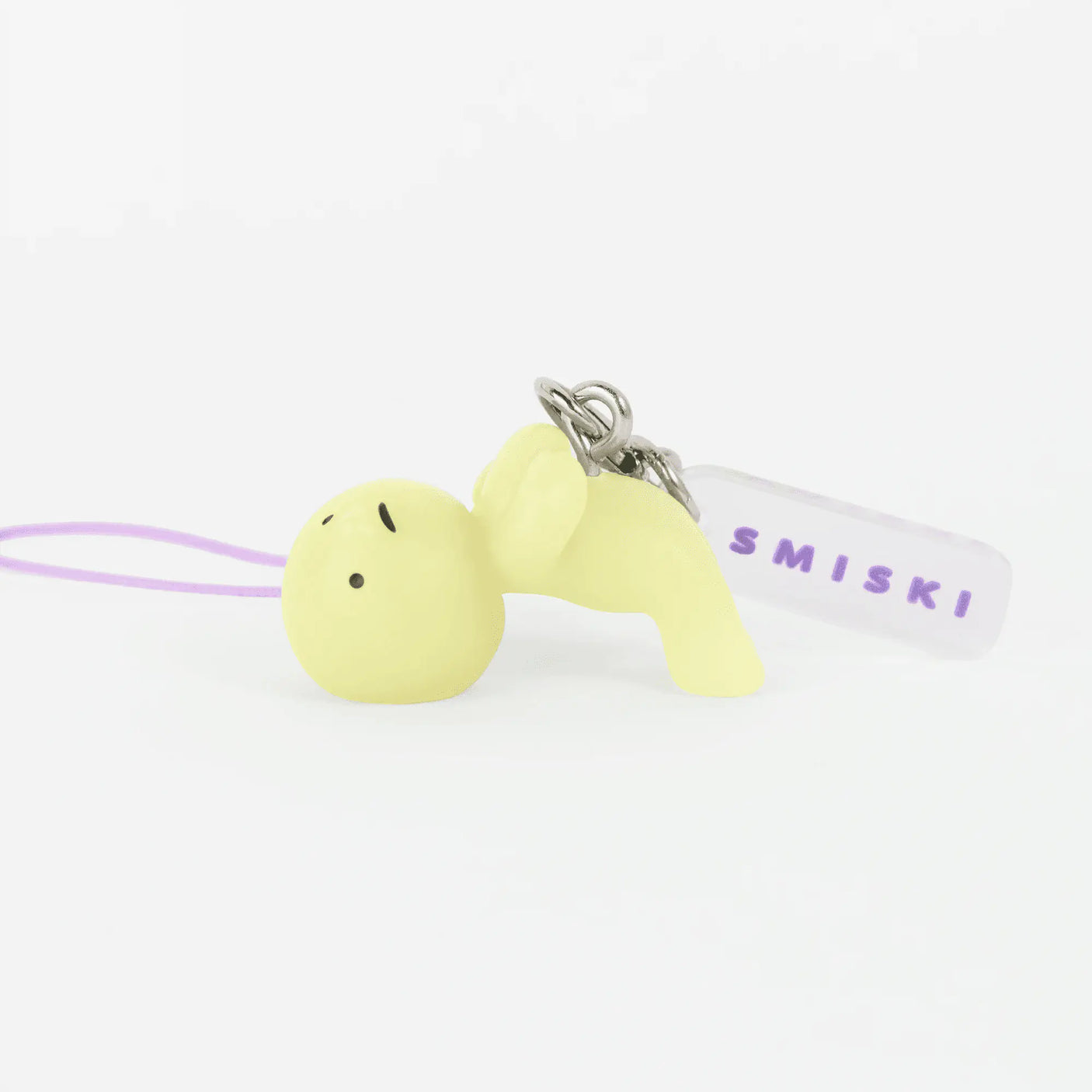 Lime green smiski strap keychain figurine with metal rings and light purple strap