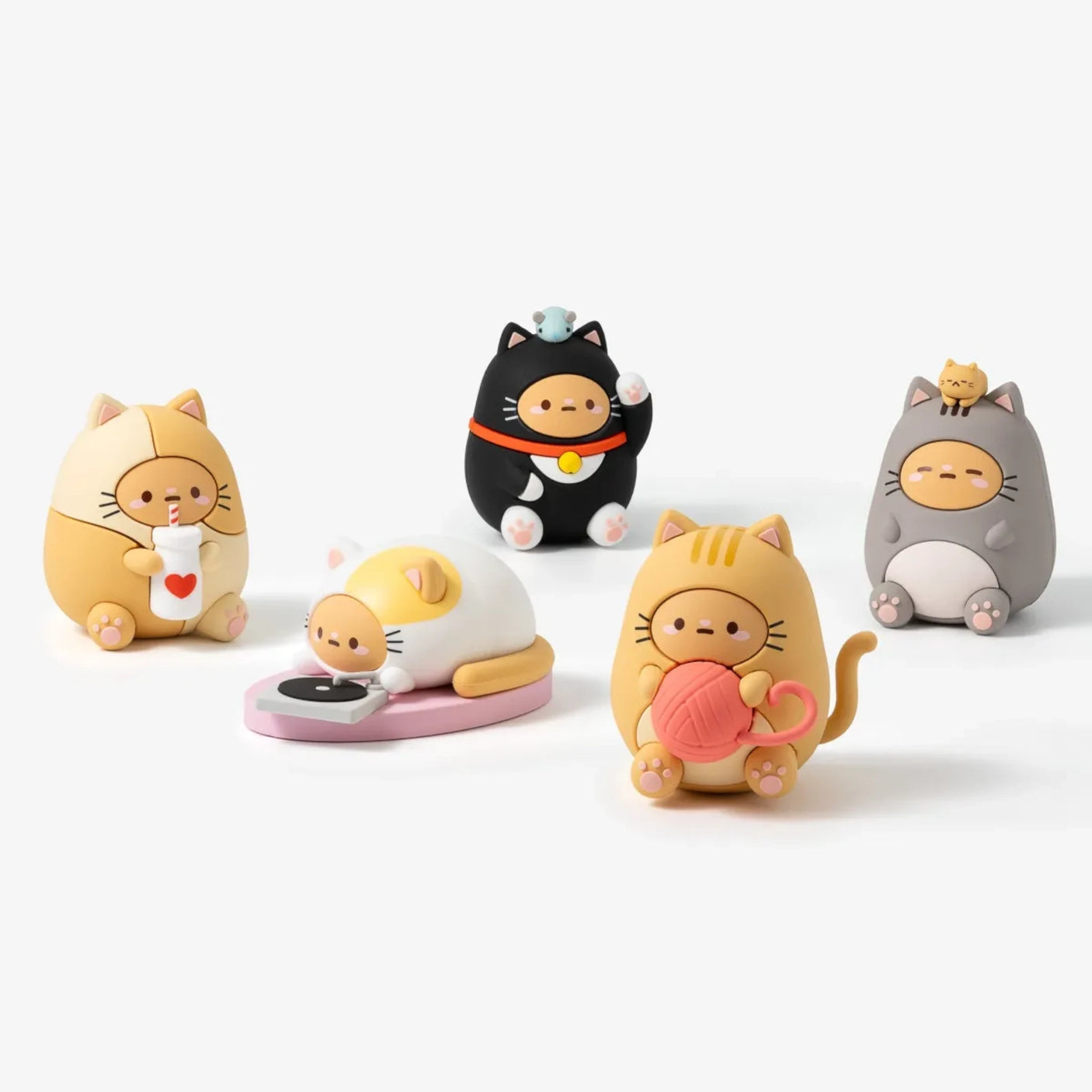 Five Smoko Tayto Chubby Cats Blind Box figures in varied cat costumes with playful accessories on a white surface.