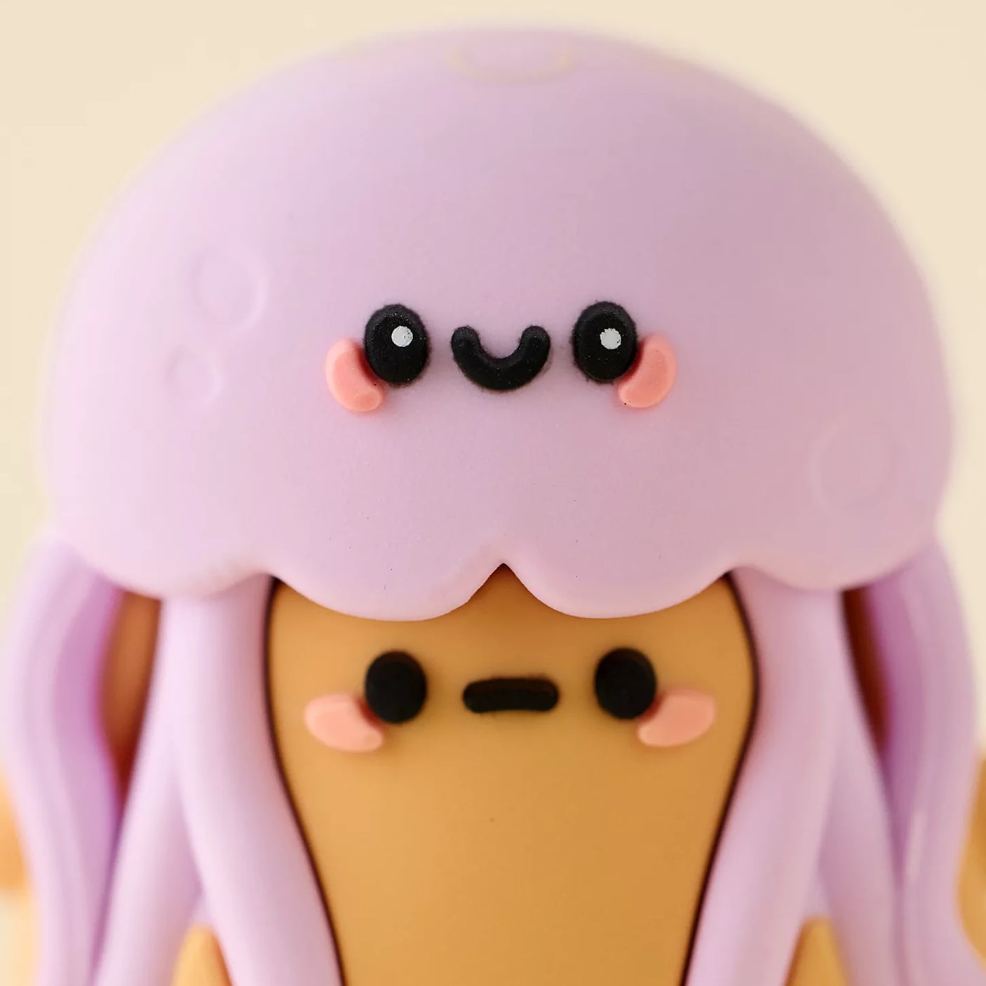 Purple jellyfish mini blind box figure with smiling face and tentacle details