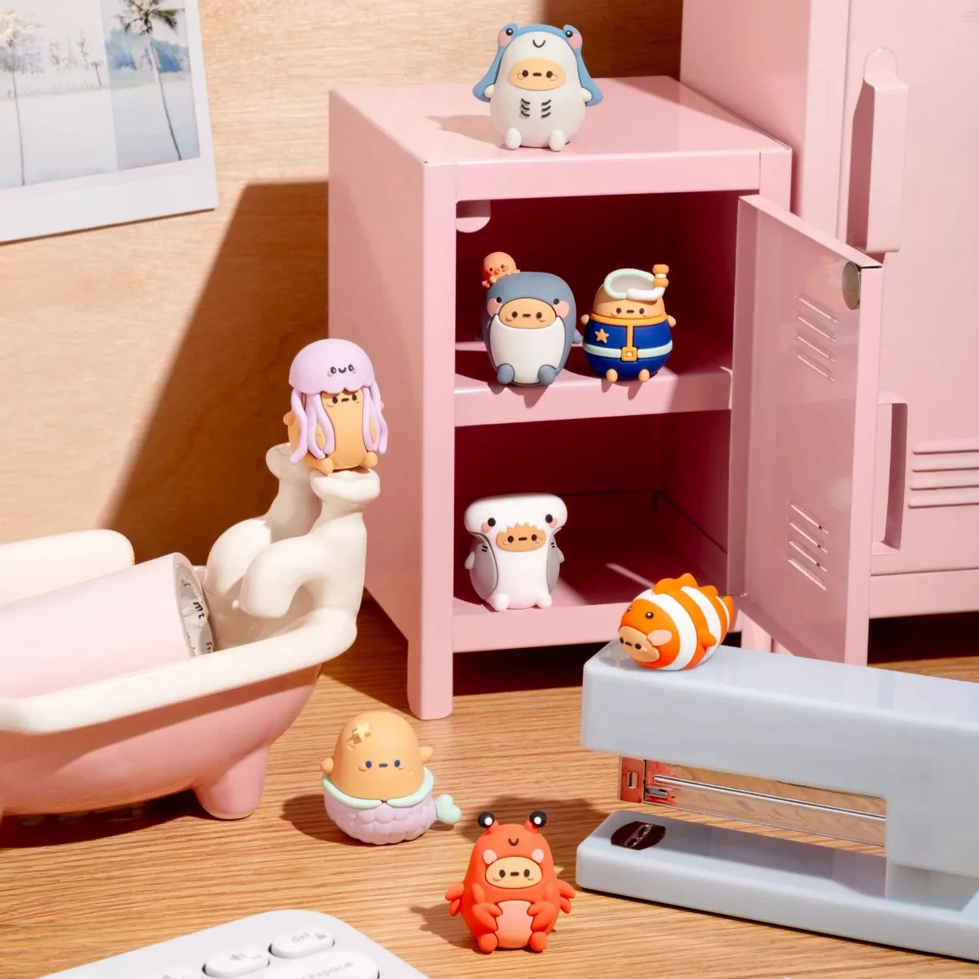 Under the Sea mini blind box figures displayed in a dollhouse cabinet