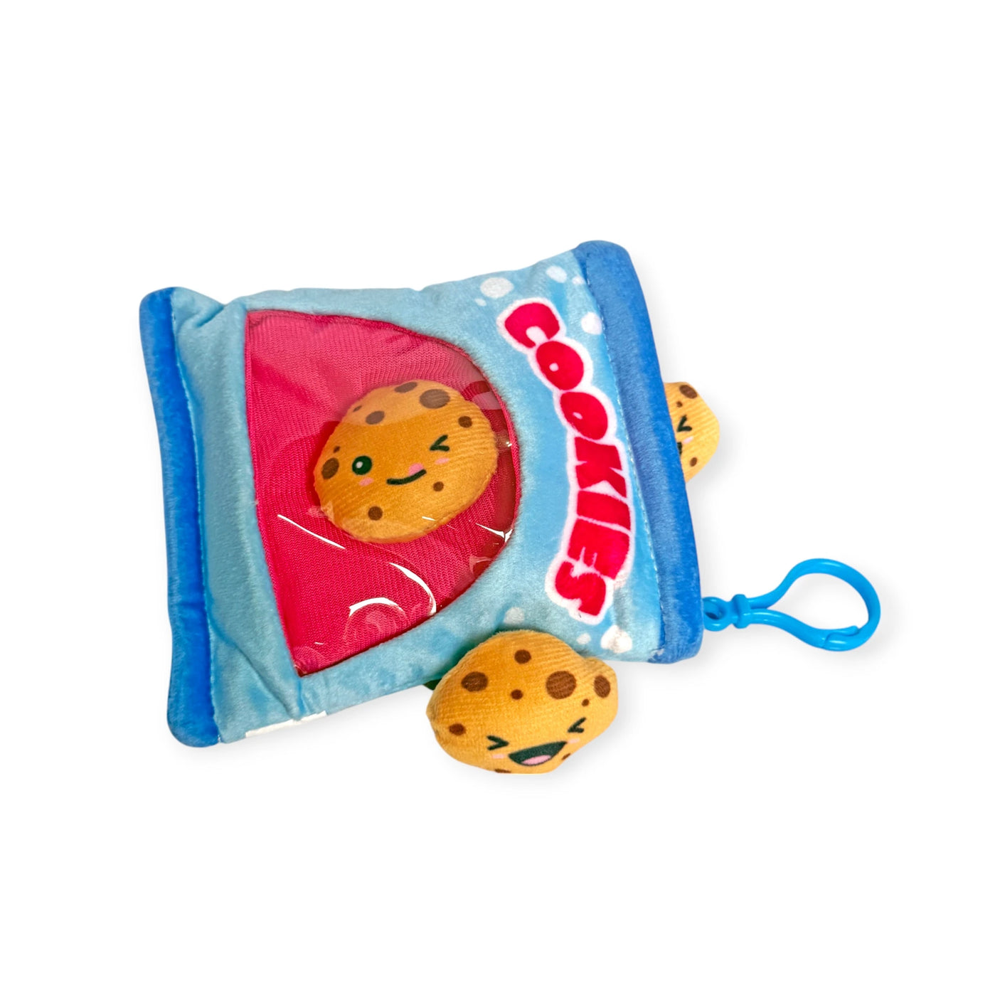 Bensons' Snack Bites Bag Charm is a plush toy styled as a cookie packet with smiling cookie faces and one playfully peeking out. Ideal for those who adore whimsical delights!.