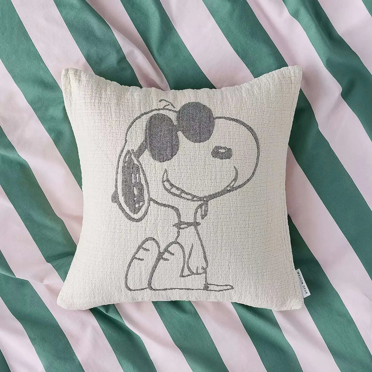 Cream cotton cushion cover with Snoopy waving graphic in gray line art
