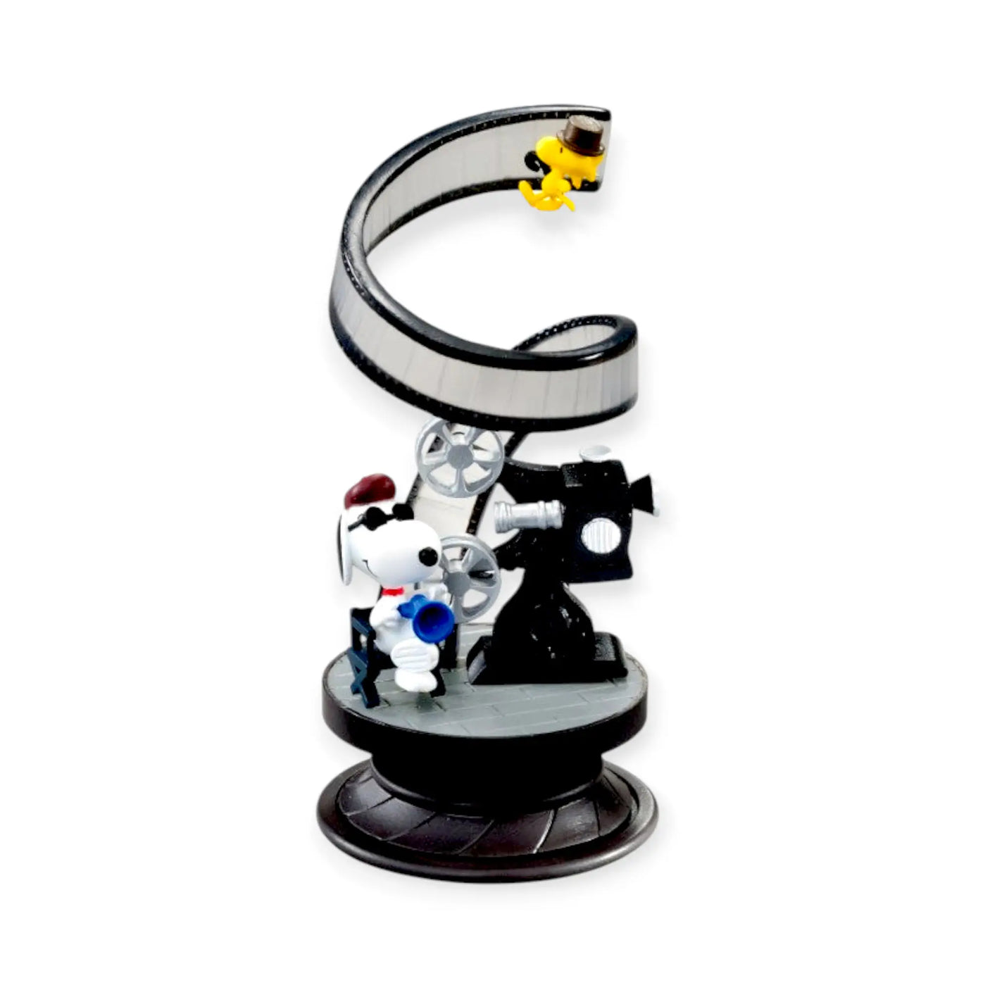 Snoopy spiral diorama blind box figure on a black base with camera-like parts and Snoopy
