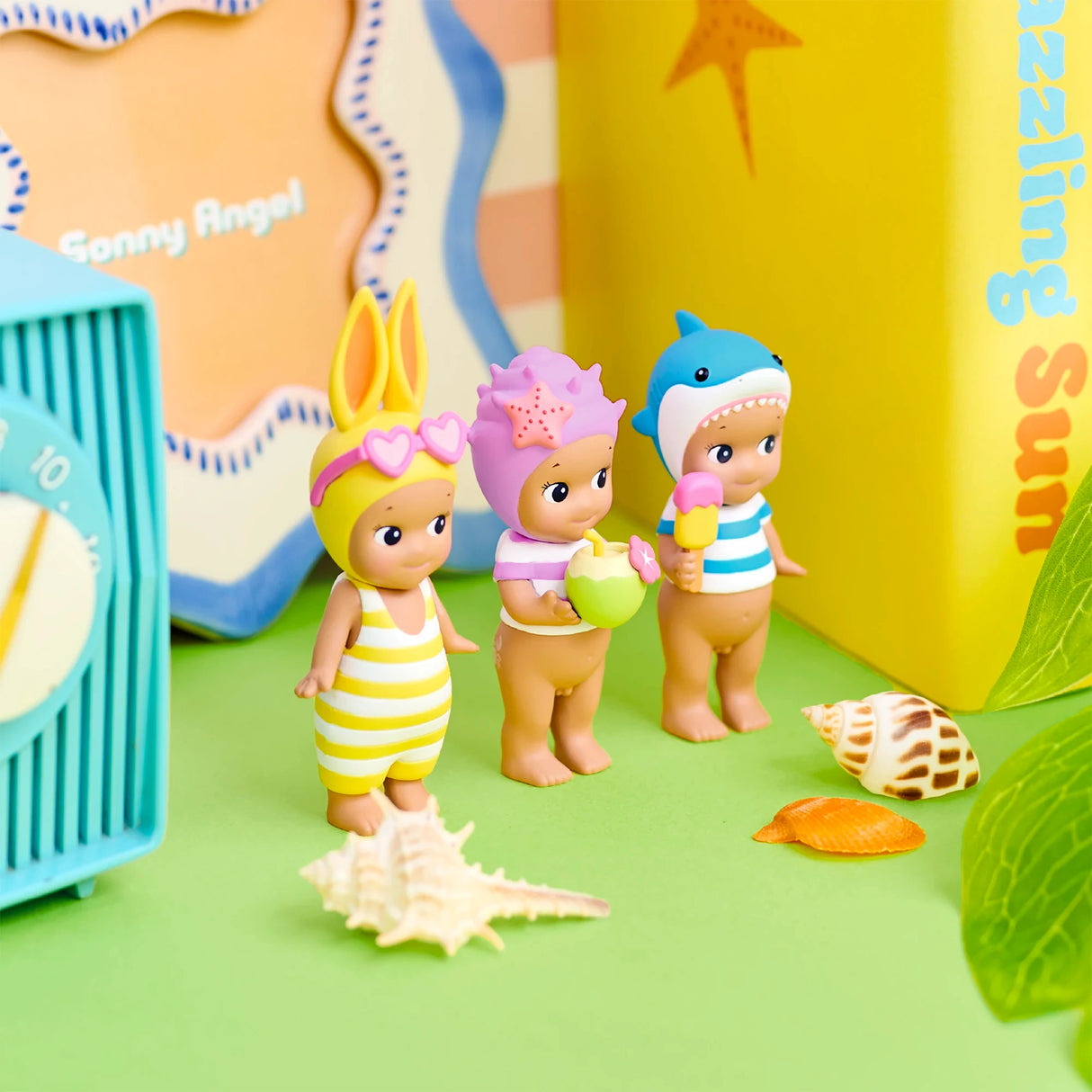 Sonny Angel Summer Vacation Sun Kissed figurines, striped swimsuits holding starfish and seashell
