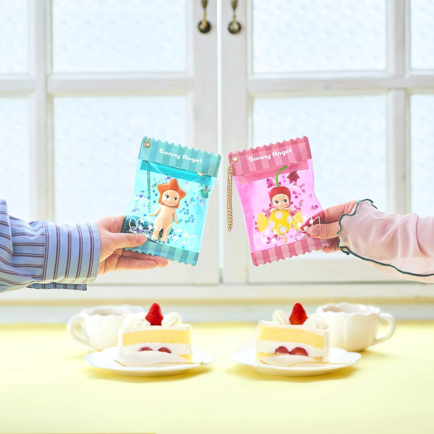 Two sweet candy cases with key chains on display
