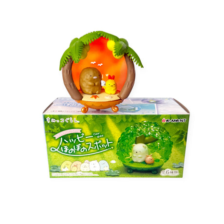 Re-Ment Sumikko Globe Blind Box featuring a Sumikko character inside a clear dome with a tropical palm tree scene.