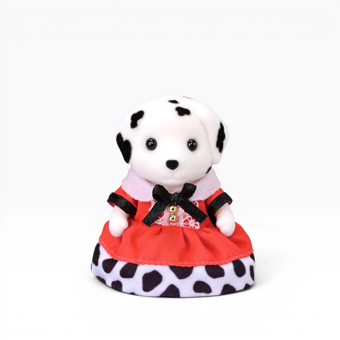 Plush dalmatian doll with red dress skirt, black trim, and pink inner collar