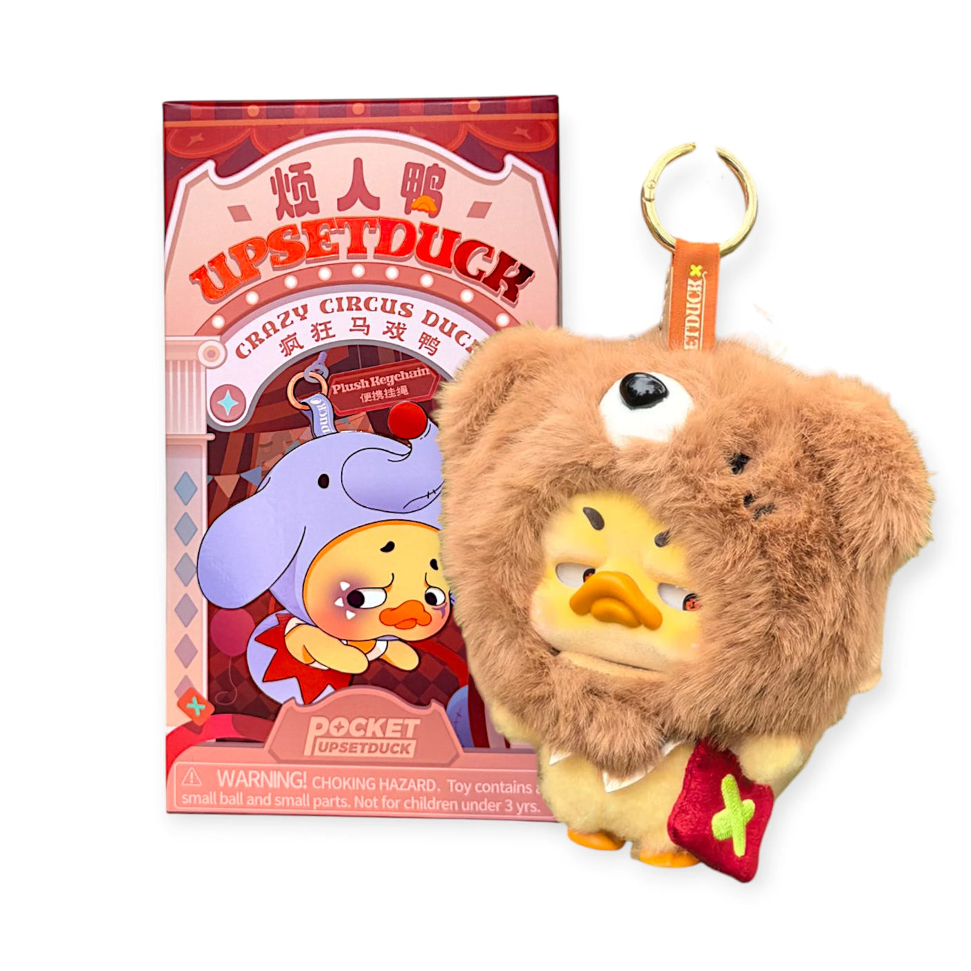 Brown plush duck keychain with bear hood and red bow, shown with a retail box