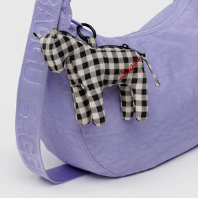 Black-and-white gingham horse charm with red detail on lavender bag strap