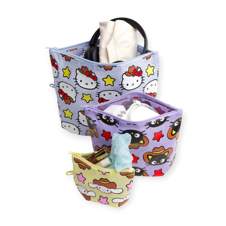 The Hello Kitty x Baggu Go Pouch Set - Western by Baggu features three colorful zippered pouches with playful Sanrio characters, each holding items like headphones, a bottle, and tissues, all shown on a white background.