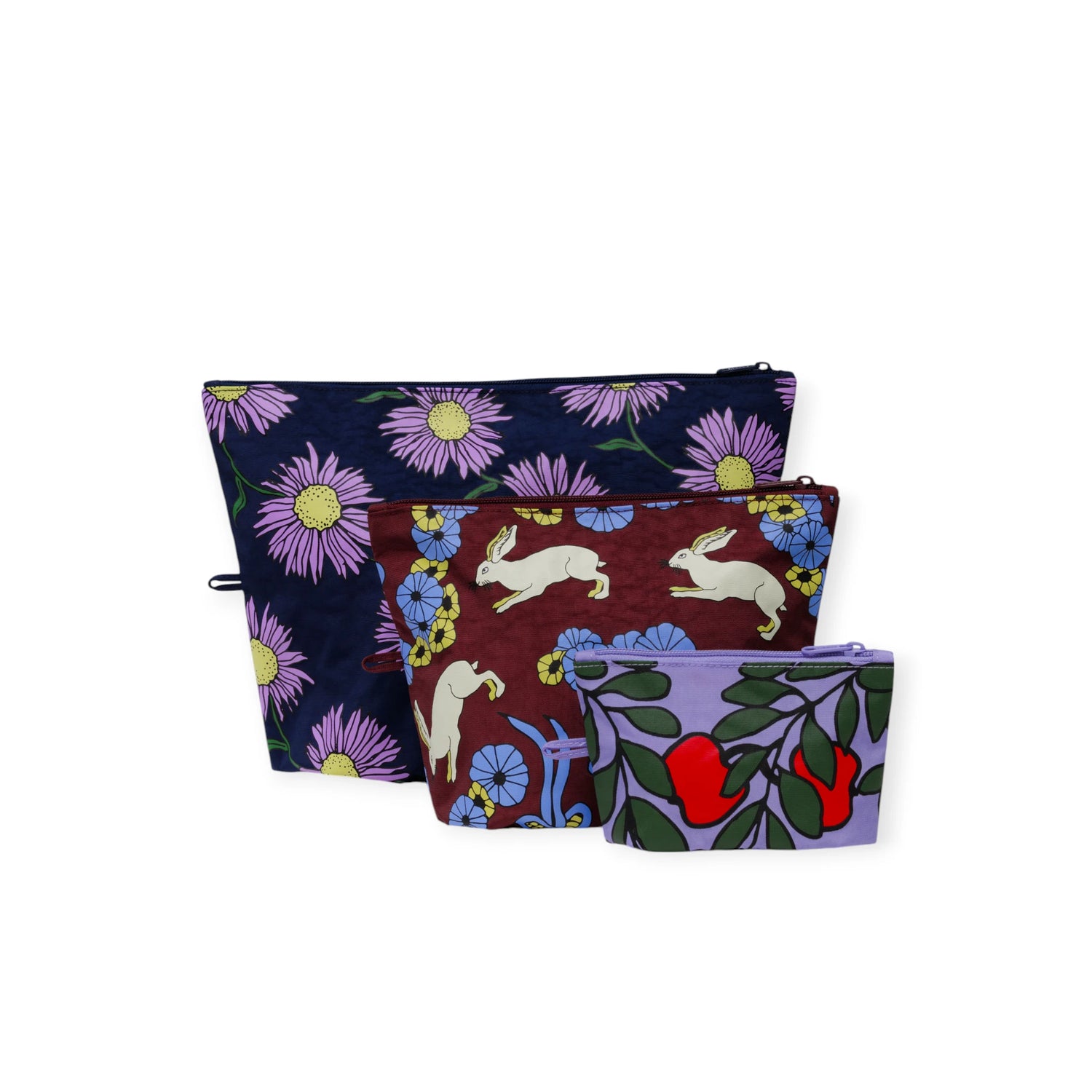 Set of three Baggu Go Pouches in Night Orchard print with floral and rabbit designs, varying sizes for versatile storage.