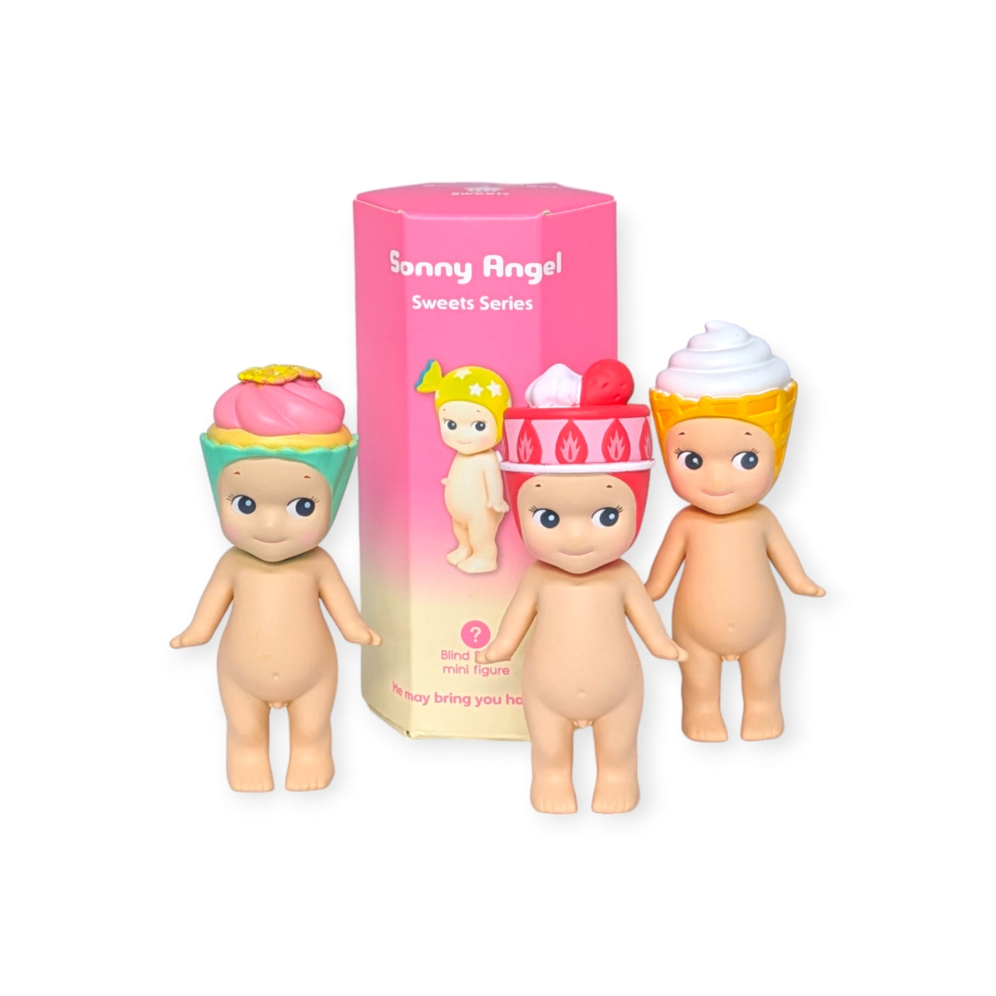 In front of a pink box labeled "Sonny Angel Sweets Series Blind Box" from the Sonny Angel brand, three collectible figures with cupcake-themed headgear are displayed as part of this exciting collection.