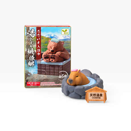 Animal onsen blind box figure with rocky gray base and small hot-spring label